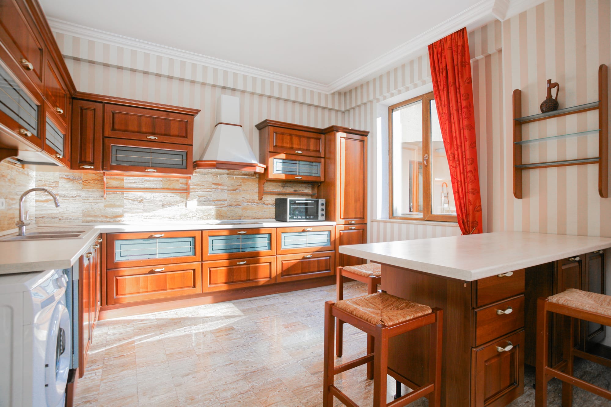 Kitchen with warm sunlight falling across the floor